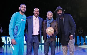 PARIS, FRANCE - JANUARY 24: Nicolas Batum #5 of the Charlotte Hornets and NBA Legends, Bruce Bowen, Tony Parker and Ronny Turiaf pose for a photo on the court before the Milwaukee Bucks against the Charlotte Hornets as part of NBA Paris Games 2020 on January 24, 2020 in Paris, France at the AccorHotels Arena. NOTE TO USER: User expressly acknowledges and agrees that, by downloading and/or using this Photograph, user is consenting to the terms and conditions of the Getty Images License Agreement. Mandatory Copyright Notice: Copyright 2020 NBAE (Photo by Catherine Steenkeste/NBAE via Getty Images)