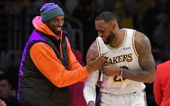 LOS ANGELES, CA - DECEMBER 29: LeBron James #23 of the Los Angeles Lakers has a moment on the sideline with former Laker Kobe Bryant in the second half during a game against the Dallas Mavericks at Staples Center on December 29, 2019 in Los Angeles, California. NOTE TO USER: User expressly acknowledges and agrees that, by downloading and/or using this photograph, user is consenting to the terms and conditions of the Getty Images License Agreement. (Photo by John McCoy/Getty Images)