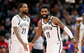 DETROIT, MI -  JANUARY 25:  Kyrie Irving #11 of the Brooklyn Nets celebrates with Wilson Chandler #21 of the Brooklyn Nets during the second half of a game against the Detroit Pistons at Little Caesars Arena on January 25, 2020, in Detroit, Michigan. The Nets defeated the Pistons 121-111 in overtime. NOTE TO USER: User expressly acknowledges and agrees that, by downloading and or using this photograph, User is consenting to the terms and conditions of the Getty Images License Agreement. (Photo by Duane Burleson/Getty Images)