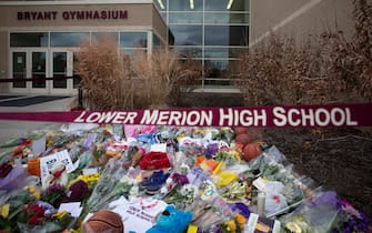 1196867404 ARDMORE, PA - JANUARY 27: Basketballs, flowers, letters, and jerseys are left at a memorial for former Los Angeles Laker Kobe Bryant after he was killed in a helicopter crash, at Lower Merion High School on January 27, 2020 in Ardmore, Pennsylvania. (Photo by Mitchell Leff/Getty Images)