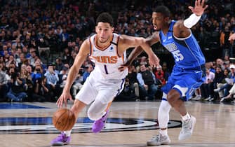 DALLAS, TX - JANUARY 28: Devin Booker #1 of the Phoenix Suns drives to the basket against the Dallas Mavericks on January 28, 2020 at the American Airlines Center in Dallas, Texas. NOTE TO USER: User expressly acknowledges and agrees that, by downloading and or using this photograph, User is consenting to the terms and conditions of the Getty Images License Agreement. Mandatory Copyright Notice: Copyright 2020 NBAE (Photo by Glenn James/NBAE via Getty Images)