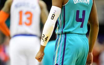 CHARLOTTE, NORTH CAROLINA - JANUARY 28: Devonte' Graham #4 of the Charlotte Hornets wears a #24 on his sleeve in honor of former NBA great Kobe Bryant during the first quarter during their game against the New York Knicks at Spectrum Center on January 28, 2020 in Charlotte, North Carolina. NOTE TO USER: User expressly acknowledges and agrees that, by downloading and/or using this photograph, user is consenting to the terms and conditions of the Getty Images License Agreement. (Photo by Jacob Kupferman/Getty Images)