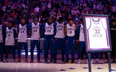 PHILADELPHIA, PA - JANUARY 28: Members of the Philadelphia 76ers stand for the national anthem prior to the game against the Golden State Warriors behind the Lower Merion High School jersey of former Los Angeles Laker star Kobe Bryant, who was killed in a helicopter crash, at the Wells Fargo Center on January 28, 2020 in Philadelphia, Pennsylvania. NOTE TO USER: User expressly acknowledges and agrees that, by downloading and/or using this photograph, user is consenting to the terms and conditions of the Getty Images License Agreement. (Photo by Mitchell Leff/Getty Images)