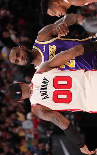 1190710015 PORTLAND, OR - DECEMBER 28: Carmelo Anthony #00 of the Portland Trail Blazers and LeBron James #23 of the Los Angeles Lakers shake hands before the game on December 28, 2019 at the Moda Center Arena in Portland, Oregon. NOTE TO USER: User expressly acknowledges and agrees that, by downloading and or using this photograph, user is consenting to the terms and conditions of the Getty Images License Agreement. Mandatory Copyright Notice: Copyright 2019 NBAE (Photo by Cameron Browne/NBAE via Getty Images)