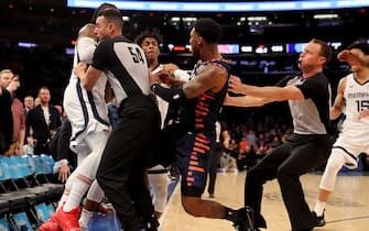 NEW YORK, NEW YORK - JANUARY 29:  The referees try to break up a fight between Jae Crowder #99 of the Memphis Grizzlies and Elfrid Payton #6 of the New York Knicks as the benches clear in the final minute of the game at Madison Square Garden on January 29, 2020 in New York City.The Memphis Grizzlies defeated the New York Knicks 127-106.NOTE TO USER: User expressly acknowledges and agrees that, by downloading and or using this photograph, User is consenting to the terms and conditions of the Getty Images License Agreement. (Photo by Elsa/Getty Images)