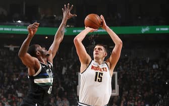 MILWAUKEE, WI - JANUARY 31: Nikola Jokic #15 of the Denver Nuggets shoots the ball against the Milwaukee Bucks on January 31, 2020 at the Fiserv Forum Center in Milwaukee, Wisconsin. NOTE TO USER: User expressly acknowledges and agrees that, by downloading and or using this Photograph, user is consenting to the terms and conditions of the Getty Images License Agreement. Mandatory Copyright Notice: Copyright 2020 NBAE (Photo by Gary Dineen/NBAE via Getty Images).