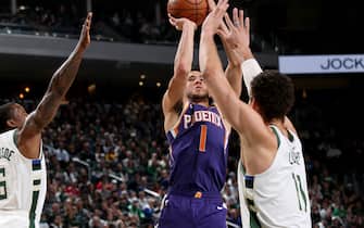 1198180905 MILWAUKEE, WI - FEBRUARY 2: Devin Booker #1 of the Phoenix Suns shoots the ball during a game against the Milwaukee Bucks on February 2, 2020 at the Fiserv Forum Center in Milwaukee, Wisconsin. NOTE TO USER: User expressly acknowledges and agrees that, by downloading and or using this Photograph, user is consenting to the terms and conditions of the Getty Images License Agreement. Mandatory Copyright Notice: Copyright 2020 NBAE (Photo by Gary Dineen/NBAE via Getty Images).