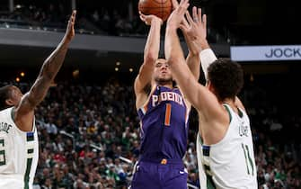 MILWAUKEE, WI - FEBRUARY 2: Devin Booker #1 of the Phoenix Suns shoots the ball during a game against the Milwaukee Bucks on February 2, 2020 at the Fiserv Forum Center in Milwaukee, Wisconsin. NOTE TO USER: User expressly acknowledges and agrees that, by downloading and or using this Photograph, user is consenting to the terms and conditions of the Getty Images License Agreement. Mandatory Copyright Notice: Copyright 2020 NBAE (Photo by Gary Dineen/NBAE via Getty Images).