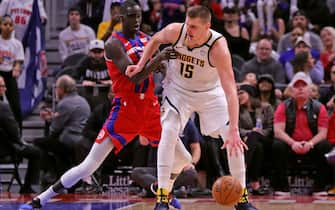 DETROIT, MI - FEBRUARY 2: Nikola Jokic #15 of the Denver Nuggets looks to drive the ball as Thon Maker #7 of the Detroit Pistons defends during the fourth quarter of the game at Little Caesars Arena on February 2, 2020 in Detroit, Michigan. Detroit defeated Denver 28-123. NOTE TO USER: User expressly acknowledges and agrees that, by downloading and or using this photograph, User is consenting to the terms and conditions of the Getty Images License Agreement (Photo by Leon Halip/Getty Images) *** Local Caption *** Nikola Jokic; Thon Maker