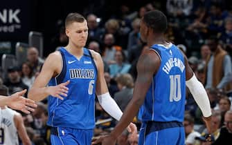 INDIANAPOLIS, IN - FEBRUARY 03: Kristaps Porzingis #6 of the Dallas Mavericks celebrates with Dorian Finney-Smith #10 after scoring a basket against the Indiana Pacers in the second half of a game at Bankers Life Fieldhouse on February 3, 2020 in Indianapolis, Indiana. The Mavericks defeated the Pacers 112-103. NOTE TO USER: User expressly acknowledges and agrees that, by downloading and or using this Photograph, user is consenting to the terms and conditions of the Getty Images License Agreement. (Photo by Joe Robbins/Getty Images)