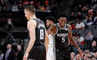 SACRAMENTO, CA - FEBRUARY 3: Bogdan Bogdanovic #8, and De'Aaron Fox #5 of the Sacramento Kings hi-five each other during the game against the Minnesota Timberwolves on February 03, 2020 at Golden 1 Center in Sacramento, California. NOTE TO USER: User expressly acknowledges and agrees that, by downloading and or using this Photograph, user is consenting to the terms and conditions of the Getty Images License Agreement. Mandatory Copyright Notice: Copyright 2020 NBAE (Photo by Rocky Widner/NBAE via Getty Images)