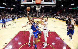 CLEVELAND, OHIO - FEBRUARY 03: Elfrid Payton #6 of the New York Knicks shoots over Larry Nance Jr. #22 of the Cleveland Cavaliers during the second half at Rocket Mortgage Fieldhouse on February 03, 2020 in Cleveland, Ohio. The Knicks defeated the Cavaliers 139-134 in overtime. NOTE TO USER: User expressly acknowledges and agrees that, by downloading and/or using this photograph, user is consenting to the terms and conditions of the Getty Images License Agreement. (Photo by Jason Miller/Getty Images)