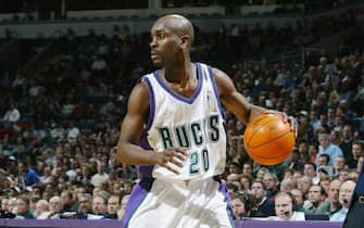 MILWAUKEE - FEBRUARY 24:  Gary Payton #20 of the Milwaukee Bucks drives against the Minnesota Timberwolves during the game at Bradley Center on February 24, 2003 in Milwaukee, Wisconsin.  The Timberwolves won 117-114.  NOTE TO USER: User expressly acknowledges and agrees that, by downloading and/or using this Photograph, User is consenting to the terms and conditions of the Getty Images License Agreement Mandatory Copyright Notice:  Copyright 2003 NBAE  (Photo by Gary Dineen/NBAE via Getty Images) 