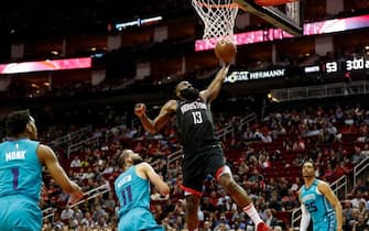 HOUSTON, TEXAS - FEBRUARY 04: James Harden #13 of the Houston Rockets drives to the basket defended by Cody Martin #11 of the Charlotte Hornets in the first half at Toyota Center on February 04, 2020 in Houston, Texas.  NOTE TO USER: User expressly acknowledges and agrees that, by downloading and or using this photograph, User is consenting to the terms and conditions of the Getty Images License Agreement. (Photo by Tim Warner/Getty Images)