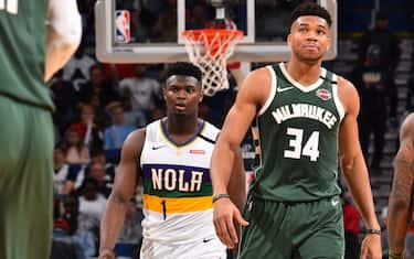 NEW ORLEANS, LA - FEBRUARY 4: Zion Williamson #1 of the New Orleans Pelicans and Giannis Antetokounmpo #34 of the Milwaukee Bucks look on during a game on February 4, 2020 at the Smoothie King Center in New Orleans, Louisiana. NOTE TO USER: User expressly acknowledges and agrees that, by downloading and or using this Photograph, user is consenting to the terms and conditions of the Getty Images License Agreement. Mandatory Copyright Notice: Copyright 2020 NBAE (Photo by Jesse D. Garrabrant/NBAE via Getty Images)