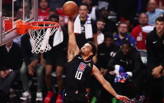 LOS ANGELES, CALIFORNIA - APRIL 21: Jerome Robinson #10 of the Los Angeles Clippers dunks the ball against the Golden State Warriors during the second quarter of Game Four of Round One of the 2019 NBA Playoffs at Staples Center on April 21, 2019 in Los Angeles, California. NOTE TO USER: User expressly acknowledges and agrees that, by downloading and or using this photograph, User is consenting to the terms and conditions of the Getty Images License Agreement. (Photo by Yong Teck Lim/Getty Images)
