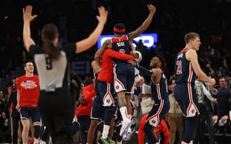 WASHINGTON, DC - FEBRUARY 07: Bradley Beal #3 of the Washington Wizards celebrates with teammates after scoring the game-winning basket in front of Delon Wright #55 of the Dallas Mavericks during the second half at Capital One Arena on February 07, 2020 in Washington, DC. NOTE TO USER: User expressly acknowledges and agrees that, by downloading and or using this photograph, User is consenting to the terms and conditions of the Getty Images License Agreement. (Photo by Patrick Smith/Getty Images)