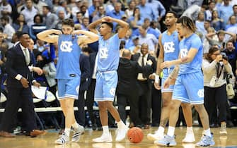 CHAPEL HILL, NORTH CAROLINA - FEBRUARY 08: Teammates Andrew Platek #3, Christian Keeling #55, Garrison Brooks #15 and Cole Anthony #2 of the North Carolina Tar Heels walk off the court after being defeated by the Duke Blue Devils 98-96 at Dean Smith Center on February 08, 2020 in Chapel Hill, North Carolina. (Photo by Streeter Lecka/Getty Images)
