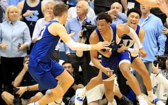 1204937756 CHAPEL HILL, NORTH CAROLINA - FEBRUARY 08: Wendell Moore Jr. #0 of the Duke Blue Devils reacts after making the game winning shot to defeat the North Carolina Tar Heels 98-96 with teammates Joey Baker #13 and Jordan Goldwire #14 during their game at Dean Smith Center on February 08, 2020 in Chapel Hill, North Carolina. (Photo by Streeter Lecka/Getty Images)