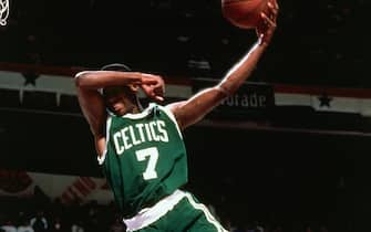 CHARLOTTE, NC - FEBRUARY 9:  Dee Brown #7 of the Boston Celtics goes up for slam dunk during the Slam Dunk Contest in the 1991 NBA All-Star Week on February 9, 1991 at Charlotte Coliseum in Charlotte, North Carolina. NOTE TO USER: User expressly acknowledges and agrees that, by downloading and/or using this Photograph, user is consenting to the terms and conditions of the Getty Images License Agreement.  Mandatory Copyright Notice: Copyright 1991 NBAE (Photo by Nathaniel S. Butler/NBAE via Getty Images)