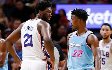 MIAMI, FLORIDA - DECEMBER 28:  Jimmy Butler #22 of the Miami Heat laughs with Joel Embiid #21 of the Philadelphia 76ers during the second half at American Airlines Arena on December 28, 2019 in Miami, Florida. NOTE TO USER: User expressly acknowledges and agrees that, by downloading and/or using this photograph, user is consenting to the terms and conditions of the Getty Images License Agreement. (Photo by Michael Reaves/Getty Images)