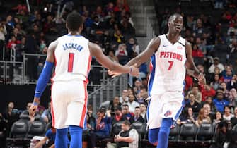 1199947045 DETROIT, MI - FEBRUARY 10: Reggie Jackson #1, and Thon Maker #7 of the Detroit Pistons hi-five each other during the game against the Charlotte Hornets on February 10, 2020 at Little Caesars Arena in Detroit, Michigan. NOTE TO USER: User expressly acknowledges and agrees that, by downloading and/or using this photograph, User is consenting to the terms and conditions of the Getty Images License Agreement. Mandatory Copyright Notice: Copyright 2020 NBAE (Photo by Chris Schwegler/NBAE via Getty Images)