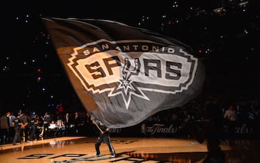 SAN ANTONIO, TX - JUNE 5: Mascot of the San Antonio Spurs holds the logo up during a timeout against the Miami Heat during Game One of the 2014 NBA Finals on June 5, 2014 at AT&T Center in San Antonio, Texas. NOTE TO USER: User expressly acknowledges and agrees that, by downloading and or using this photograph, User is consenting to the terms and conditions of the Getty Images License Agreement. Mandatory Copyright Notice: Copyright 2014 NBAE (Photo by Jesse D. Garrabrant/NBAE via Getty Images)