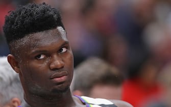 1205353517 CHICAGO, ILLINOIS - FEBRUARY 06: Zion Williamson #1 of the New Orleans Pelicans watches from the bench as teammates take on the Chicago Bulls at the United Center on February 06, 2020 in Chicago, Illinois. NOTE TO USER: User expressly acknowledges and agrees that, by downloading and or using this photograph, User is consenting to the terms and conditions of the Getty Images License Agreement. (Photo by Jonathan Daniel/Getty Images)