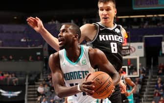 1189312401 CHARLOTTE, NC - DECEMBER 17: Michael Kidd-Gilchrist #14 of the Charlotte Hornets drives to the basket against the Sacramento Kings on December 17, 2019 at Spectrum Center in Charlotte, North Carolina. NOTE TO USER: User expressly acknowledges and agrees that, by downloading and or using this photograph, User is consenting to the terms and conditions of the Getty Images License Agreement. Mandatory Copyright Notice: Copyright 2019 NBAE (Photo by Kent Smith/NBAE via Getty Images)