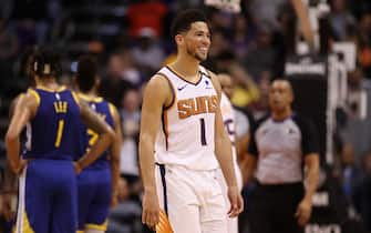PHOENIX, ARIZONA - FEBRUARY 12:  Devin Booker #1 of the Phoenix Suns reacts during the second half of the NBA game against the Golden State Warriors at Talking Stick Resort Arena on February 12, 2020 in Phoenix, Arizona. The Suns defeated the Warriors 112-106. NOTE TO USER: User expressly acknowledges and agrees that, by downloading and or using this photograph, user is consenting to the terms and conditions of the Getty Images License Agreement. Mandatory Copyright Notice: Copyright 2020 NBAE. (Photo by Christian Petersen/Getty Images)