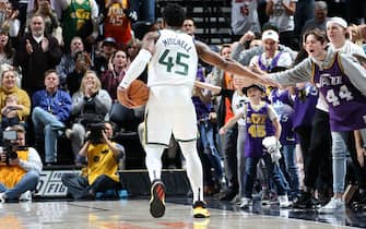 SALT LAKE CITY, UT - DECEMBER 17: Donovan Mitchell #45 of the Utah Jazz hi-fives a fan during the game against the Orlando Magic on December 17, 2019 at Vivint Smart Home Arena in Salt Lake City, Utah. NOTE TO USER: User expressly acknowledges and agrees that, by downloading and or using this Photograph, User is consenting to the terms and conditions of the Getty Images License Agreement. Mandatory Copyright Notice: Copyright 2019 NBAE (Photo by Melissa Majchrzak/NBAE via Getty Images)