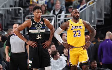 MILWAUKEE, WI - DECEMBER 19: Giannis Antetokounmpo #34 of the Milwaukee Bucks and LeBron James #23 of the Los Angeles Lakers look on during a game on December 19, 2019 at the Fiserv Forum Center in Milwaukee, Wisconsin. NOTE TO USER: User expressly acknowledges and agrees that, by downloading and or using this Photograph, user is consenting to the terms and conditions of the Getty Images License Agreement. Mandatory Copyright Notice: Copyright 2019 NBAE (Photo by Joe Murphy/NBAE via Getty Images). 