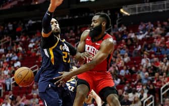 1205171659 HOUSTON, TEXAS - FEBRUARY 09: James Harden #13 of the Houston Rockets passes the ball defended by Rudy Gobert #27 of the Utah Jazz in the second half at Toyota Center on February 09, 2020 in Houston, Texas. NOTE TO USER: User expressly acknowledges and agrees that, by downloading and or using this photograph, User is consenting to the terms and conditions of the Getty Images License Agreement. (Photo by Tim Warner/Getty Images)