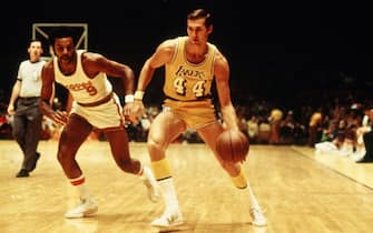 INGLEWOOD, CA - 1971:  Jerry West #44 of the Los Angeles Lakers  dribbles against Herm Gilliam #9 of the Buffalo Braves at the Great Western Forum in Inglewood, California circa 1971. NOTE TO USER: User expressly acknowledges and agrees that, by downloading and or using this photograph, User is consenting to the terms and conditions of the Getty Images License Agreement. Mandatory Copyright Notice: Copyright 1971 NBAE (Photo by Wen Roberts/NBAE via Getty Images)