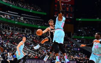 ATLANTA, GA - FEBRUARY 2020: Trae Young #11 of the Atlanta Hawks looks to pass the ball against the Miami Heat on February 20, 2020 at State Farm Arena in Atlanta, Georgia.  NOTE TO USER: User expressly acknowledges and agrees that, by downloading and/or using this Photograph, user is consenting to the terms and conditions of the Getty Images License Agreement. Mandatory Copyright Notice: Copyright 2020 NBAE (Photo by Scott Cunningham/NBAE via Getty Images)