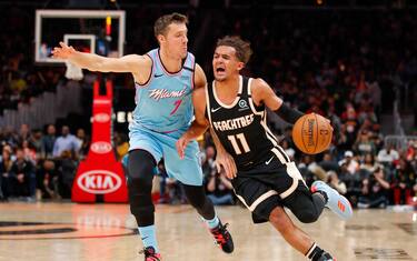 ATLANTA, GA - FEBRUARY 20: Trae Young #11 of the Atlanta Hawks drives to the basket against Goran Dragic #7 of the Miami Heat during the second half of an NBA game at State Farm Arena on February 20, 2020 in Atlanta, Georgia. NOTE TO USER: User expressly acknowledges and agrees that, by downloading and/or using this photograph, user is consenting to the terms and conditions of the Getty Images License Agreement. (Photo by Todd Kirkland/Getty Images)