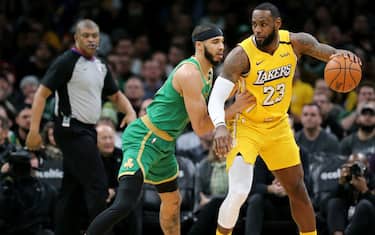 BOSTON, MASSACHUSETTS - JANUARY 20: Jayson Tatum #0 of the Boston Celtics defends LeBron James #23 of the Los Angeles Lakers at TD Garden on January 20, 2020 in Boston, Massachusetts. The Celtics defeat the Lakers 139-107.  (Photo by Maddie Meyer/Getty Images)