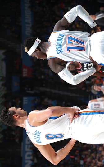 OKLAHOMA CITY, OK - JANUARY 15: Danilo Gallinari #8 of the Oklahoma City Thunder and Dennis Schroder #17 of the Oklahoma City Thunder talk during game against the Toronto Raptors on January 15, 2020 at Chesapeake Energy Arena in Oklahoma City, Oklahoma. NOTE TO USER: User expressly acknowledges and agrees that, by downloading and or using this photograph, User is consenting to the terms and conditions of the Getty Images License Agreement. Mandatory Copyright Notice: Copyright 2020 NBAE (Photo by Zach Beeker/NBAE via Getty Images)