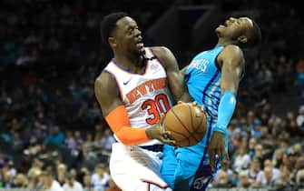 1208920844 CHARLOTTE, NORTH CAROLINA - FEBRUARY 26: Julius Randle #30 of the New York Knicks collides with Terry Rozier #3 of the Charlotte Hornets during their game at Spectrum Center on February 26, 2020 in Charlotte, North Carolina. NOTE TO USER: User expressly acknowledges and agrees that, by downloading and or using this photograph, User is consenting to the terms and conditions of the Getty Images License Agreement. (Photo by Streeter Lecka/Getty Images)