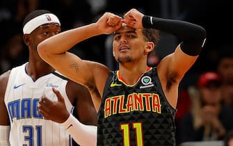 ATLANTA, GEORGIA - FEBRUARY 26:  Trae Young #11 of the Atlanta Hawks reacts in the second half against the Orlando Magic at State Farm Arena on February 26, 2020 in Atlanta, Georgia.  NOTE TO USER: User expressly acknowledges and agrees that, by downloading and/or using this photograph, user is consenting to the terms and conditions of the Getty Images License Agreement.  (Photo by Kevin C. Cox/Getty Images)