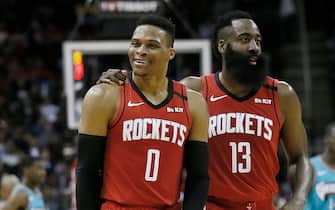 HOUSTON, TEXAS - FEBRUARY 26: Russell Westbrook #0 of the Houston Rockets is calmed down by James Harden #13 after a technical foul was called on him during the second quarter against the Memphis Grizzlies at Toyota Center on February 26, 2020 in Houston, Texas.  NOTE TO USER: User expressly acknowledges and agrees that, by downloading and/or using this photograph, user is consenting to the terms and conditions of the Getty Images License Agreement. (Photo by Bob Levey/Getty Images)