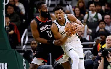 MILWAUKEE, WISCONSIN - MARCH 26:  Giannis Antetokounmpo #34 of the Milwaukee Bucks is defended by James Harden #13 of the Houston Rockets during the second half of a game at Fiserv Forum on March 26, 2019 in Milwaukee, Wisconsin. NOTE TO USER: User expressly acknowledges and agrees that, by downloading and or using this photograph, User is consenting to the terms and conditions of the Getty Images License Agreement. (Photo by Stacy Revere/Getty Images)