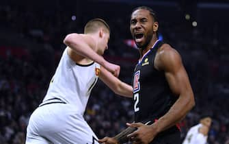 LOS ANGELES, CALIFORNIA - FEBRUARY 28:  Kawhi Leonard #2 of the LA Clippers calls for a foul behind Nikola Jokic #15 of the Denver Nuggets during the first half at Staples Center on February 28, 2020 in Los Angeles, California. (Photo by Harry How/Getty Images)