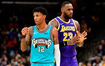 MEMPHIS, TN - NOVEMBER 23: Ja Morant #12 of the Memphis Grizzlies and LeBron James #23 of the Los Angeles Lakers stand on the court at FedExForum on November 23, 2019 in Memphis, Tennessee. NOTE TO USER: User expressly acknowledges and agrees that, by downloading and/or using this photograph, user is consenting to the terms and conditions of the Getty Images License Agreement. (Photo by Brandon Dill/Getty Images)