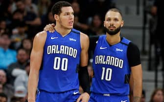 SAN ANTONIO, TX - FEBRUARY 29:  Aaron Gordon #00 of the Orlando Magic is comforted by teammate Evan Fournier #10 after he was called for a foul during s second half action at AT&T Center on February  29, 2020 in San Antonio, Texas.  San Antonio Spurs defeated the Orlando Magic 114-113. NOTE TO USER: User expressly acknowledges and agrees that , by downloading and or using this photograph, User is consenting to the terms and conditions of the Getty Images License Agreement. (Photo by Ronald Cortes/Getty Images)