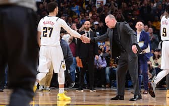 DENVER, CO - MARCH 1: Head Coach, Jamal Murray #27 of the Denver Nuggets high fives his player during the game against the Toronto Raptors on March 1, 2020 at the Pepsi Center in Denver, Colorado. NOTE TO USER: User expressly acknowledges and agrees that, by downloading and/or using this Photograph, user is consenting to the terms and conditions of the Getty Images License Agreement. Mandatory Copyright Notice: Copyright 2020 NBAE (Photo by Bart Young/NBAE via Getty Images)