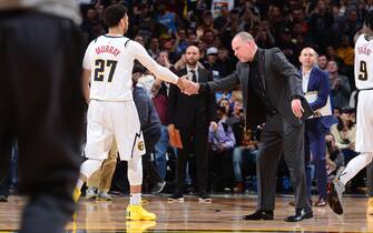 1204559533 DENVER, CO - MARCH 1: Head Coach, Jamal Murray #27 of the Denver Nuggets high fives his player during the game against the Toronto Raptors on March 1, 2020 at the Pepsi Center in Denver, Colorado. NOTE TO USER: User expressly acknowledges and agrees that, by downloading and/or using this Photograph, user is consenting to the terms and conditions of the Getty Images License Agreement. Mandatory Copyright Notice: Copyright 2020 NBAE (Photo by Bart Young/NBAE via Getty Images)