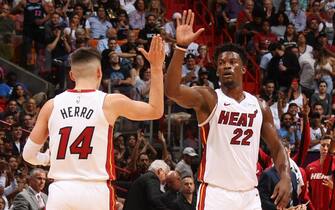 MIAMI, FL - OCTOBER 29: Tyler Herro #14 of the Miami Heat and Jimmy Butler #22 of the Miami Heat high-five during a game on October 29, 2019 at American Airlines Arena in Miami, Florida. NOTE TO USER: User expressly acknowledges and agrees that, by downloading and or using this Photograph, user is consenting to the terms and conditions of the Getty Images License Agreement. Mandatory Copyright Notice: Copyright 2019 NBAE (Photo by Oscar Baldizon/NBAE via Getty Images)