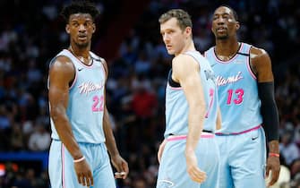MIAMI, FLORIDA - MARCH 02:  Jimmy Butler #22, Goran Dragic #7 and Bam Adebayo #13 of the Miami Heat look on against the Milwaukee Bucks during the second half at American Airlines Arena on March 02, 2020 in Miami, Florida. NOTE TO USER: User expressly acknowledges and agrees that, by downloading and/or using this photograph, user is consenting to the terms and conditions of the Getty Images License Agreement.  (Photo by Michael Reaves/Getty Images)