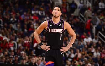 PHOENIX, AZ - MARCH 3: Devin Booker #1 of the Phoenix Suns looks on during the game against the Toronto Raptors on March 3, 2020 at Talking Stick Resort Arena in Phoenix, Arizona. NOTE TO USER: User expressly acknowledges and agrees that, by downloading and or using this photograph, user is consenting to the terms and conditions of the Getty Images License Agreement. Mandatory Copyright Notice: Copyright 2020 NBAE (Photo by Barry Gossage/NBAE via Getty Images)